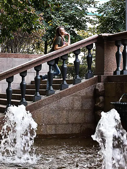 Cutie Leila A is spreading her stockings legs and showing the ni