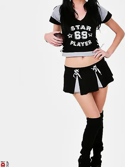 The cute brunette cheerleader Eileen Nubiles is naked with the p