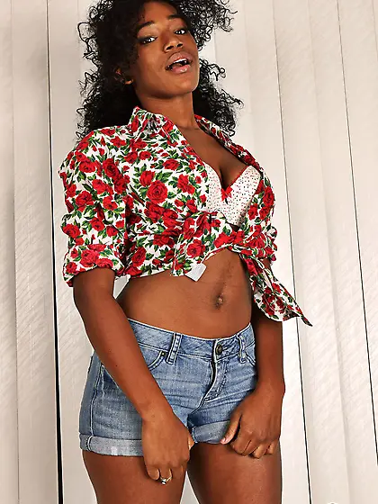 Black teen with curly hair and round butt opens her pinky flower