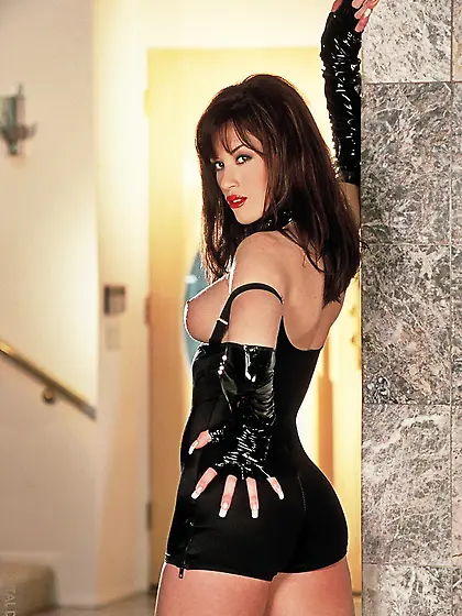 Brunette dominatrix leather teases
