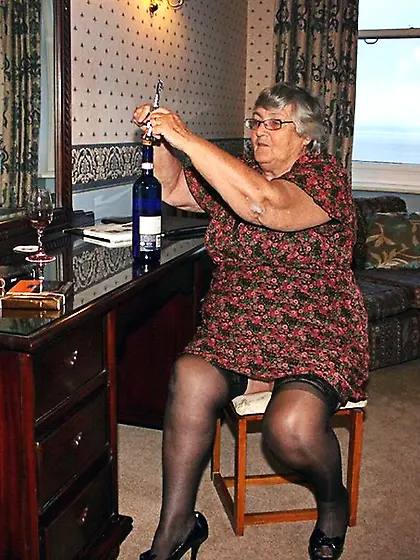 Chick pops drinks wine