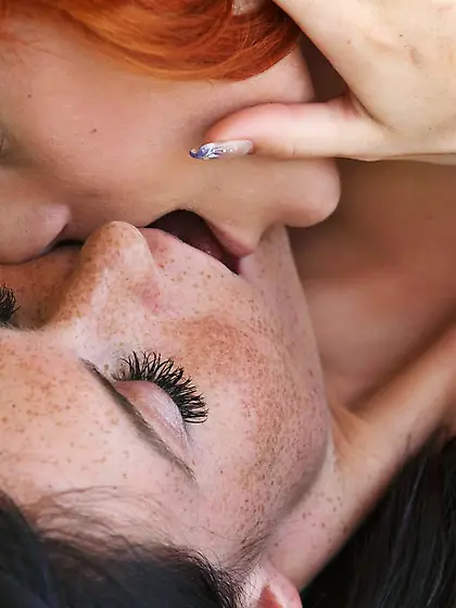 Brunette Eileen Nubiles and redhead Ariel A passionately kissing