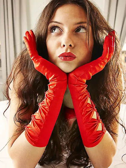 Irina N poses in front of the camera drinking wine and wearing s