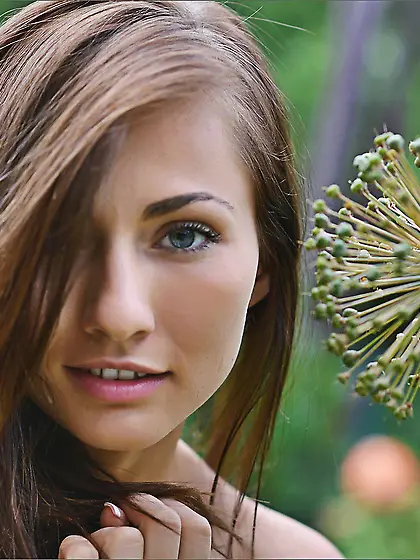 Posing totally nude outdoor and revealing taco on the grass make