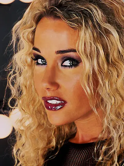 Classy blonde babe Kristi Myst strips her fishnet top and shows