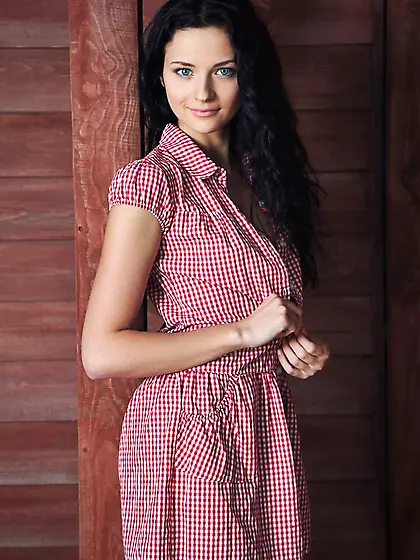 Sweet and seductive young girl bends over to show her hot pussy