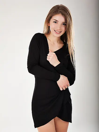 Shy cutie peels off small black dress to show her beautiful nake