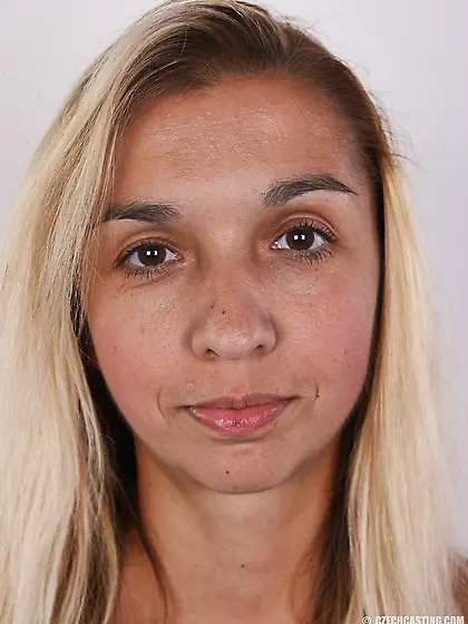 Young blonde model strips