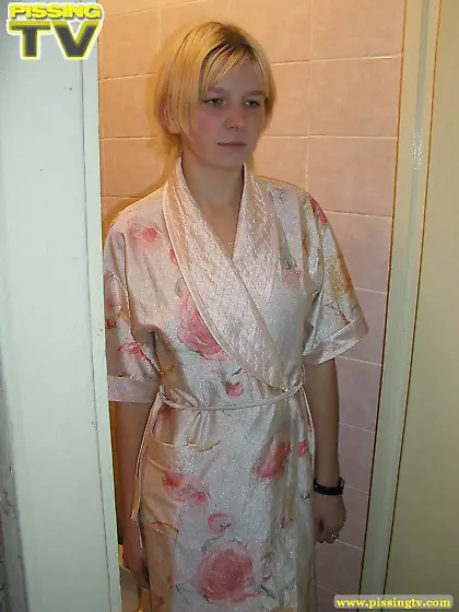 Teen blonde pees in the toilet