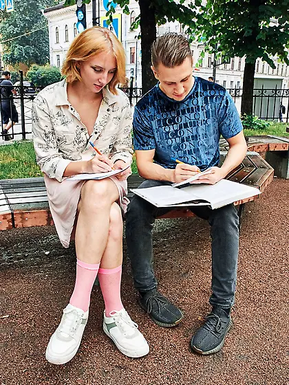 Emma Korti exposes her cute ass and takes a boner on a bed