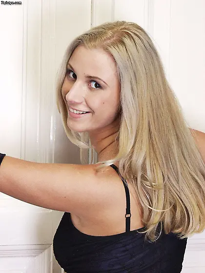 Blonde Britany pets her tits by hands in gloves and tears her fi