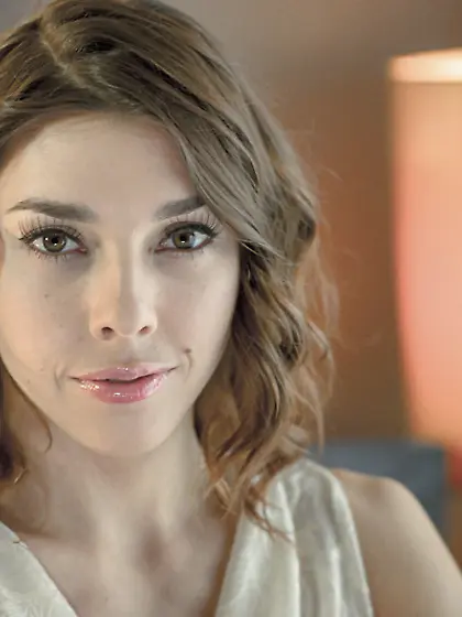 Cute pale-skinned girl exposes