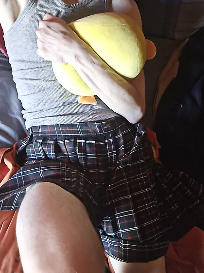 fakeboy in schoolgirl clothes with plushie