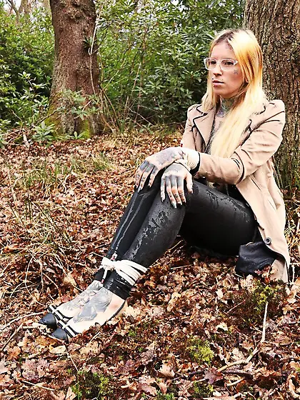 Girl with glasses can't stand up because she is hogtied by the t