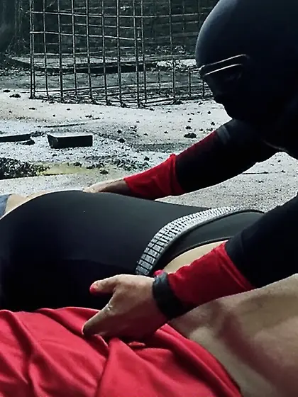 Black Superhero captured in netting.  KO and fondle