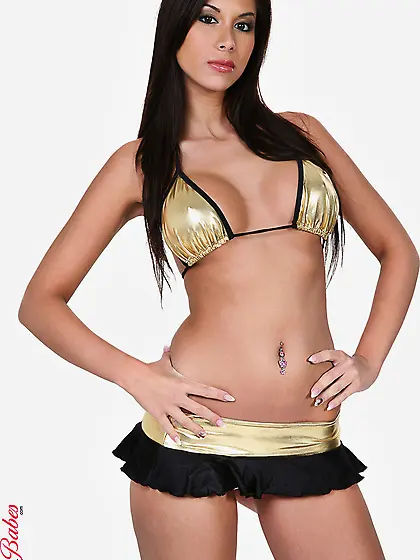 Busty brunette babe Ashley Brooke strips her mini skirt and show