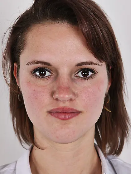 Female smiles so shy but still keeps on stripping naked in photo