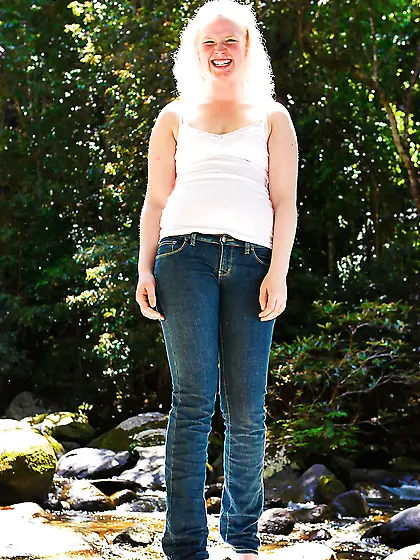 Swanky blonde showing her nude and hairy pussy outside