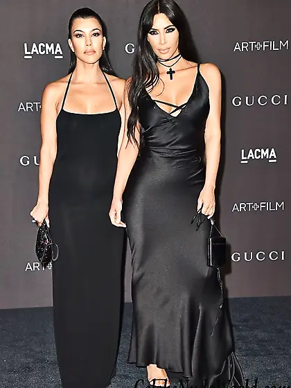Busty Kardashian sisters in a skimpy black gowns