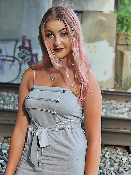 Pink hair girl showing off under the bridge and looking perfect