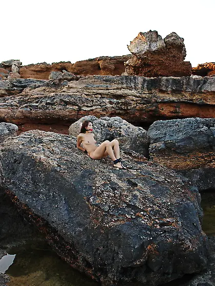 Merciless male submerses face of skinny teen with tied up hands