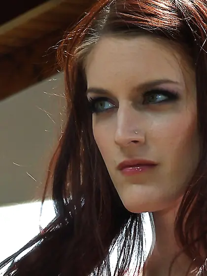 Redhead strips down and draws attention to her hungry pussy pull