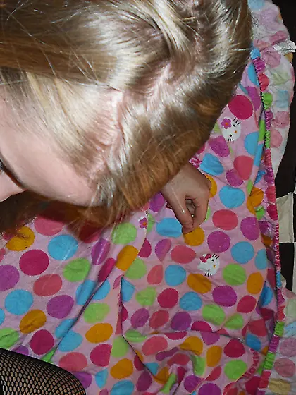 Fishnet stockings,  top and panty are covering the delicious body