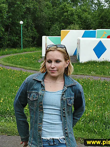 Pissing on a outdoor teeterboard