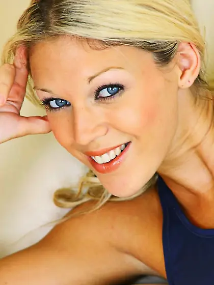 Blonde Belle wearing a gym outfit with white...