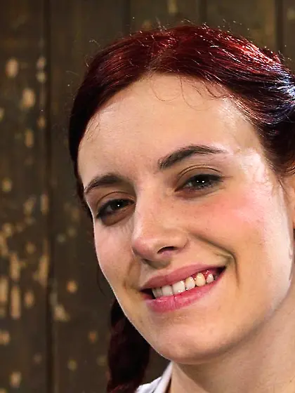 Chains hold red-haired harlot