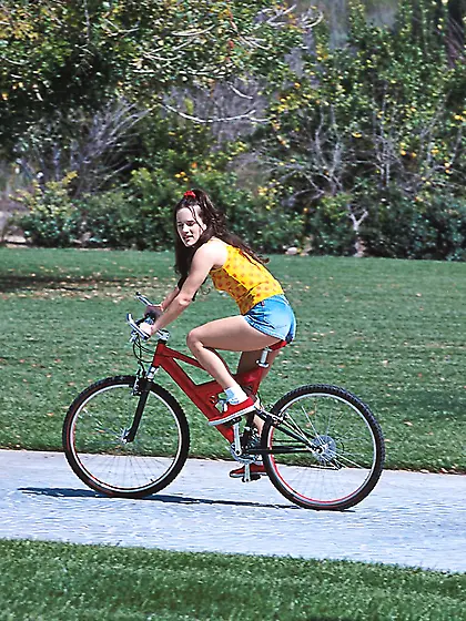 Cute teen chick Jenna Lyte strips her red thongs outdoors and fi