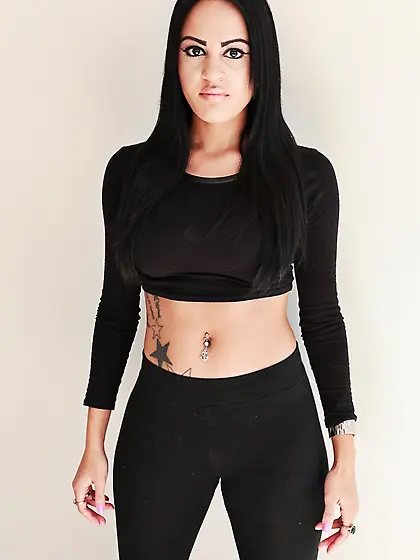 Busty brunette Kimberly Kendall stays in nothing but red shoes a