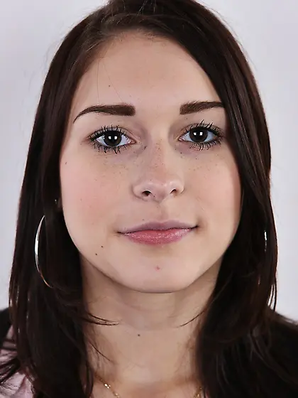 Chick with black eyes unshrouds breasts getting naked in front o