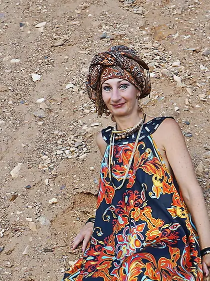 With spear wearing in colorful dress