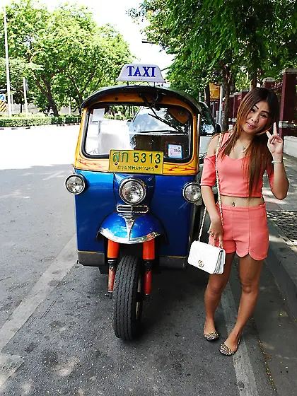 Joyful Thai minx poses near white fellow and his impressive auto