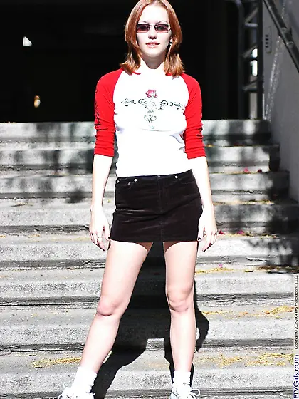 Red-haired cutie Smokie Flame squeezes her boobs while exposing