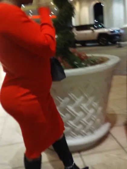Red dress juicy GILF with phat ass at the casino.