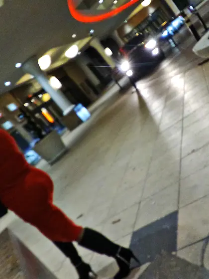 Red dress juicy GILF with phat ass at the casino.