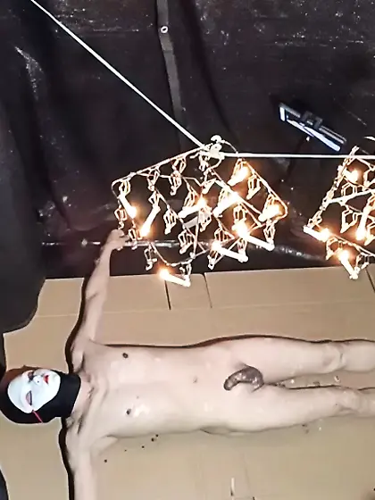 Wax is dripping from the laundry hanger.