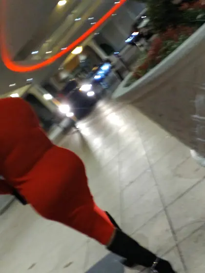 Red dress juicy GILF with phat ass at the casino.