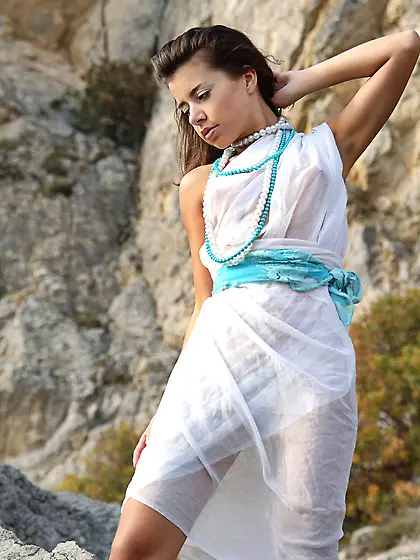 Rita B removes all of her lingerie outdoors and shows us her fan