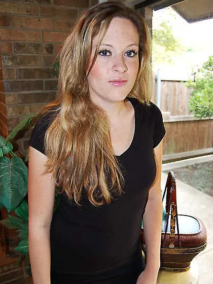 Blonde babe in a black dress shows off her...