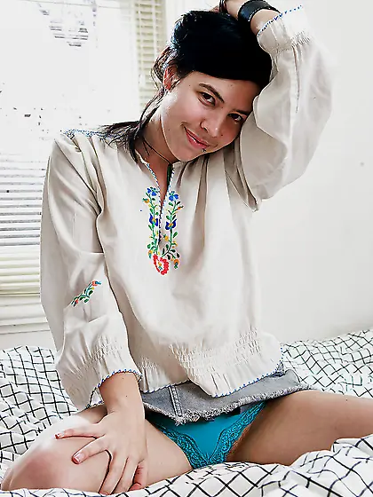 Brunette in a traditional outfit exposes her nice boobs and more