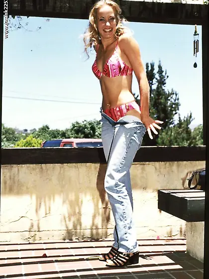 Petite bushy girl Roxy Tucker with small tits and alluring smile