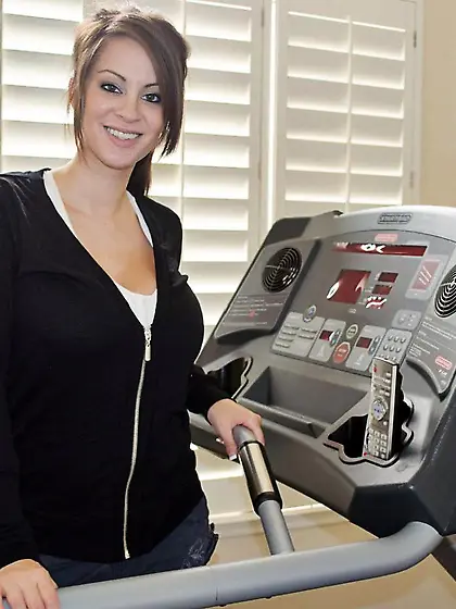 Good looking Talia Shepard is smiling while getting ready to wor