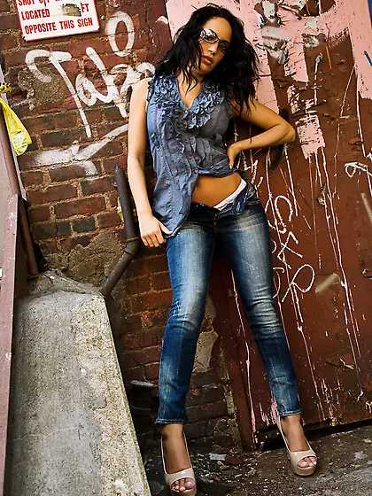 Astonishing brunette shows us her enormous tits.