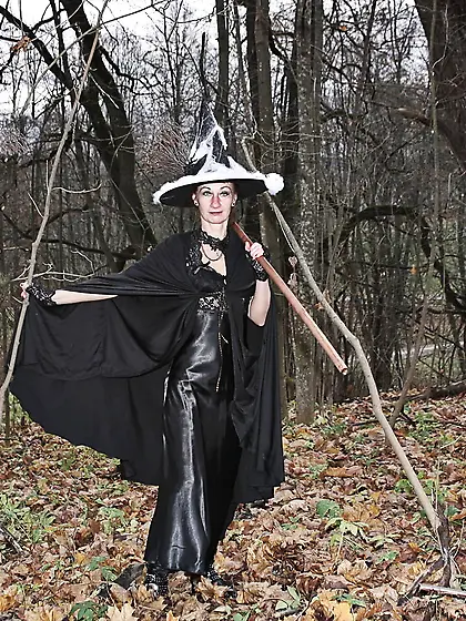 Witch with broom in forest