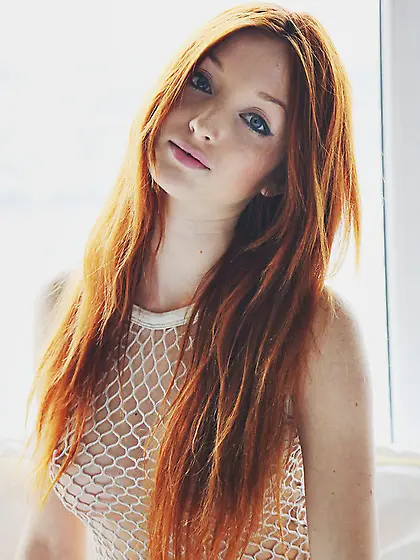 Thin red-haired tart white