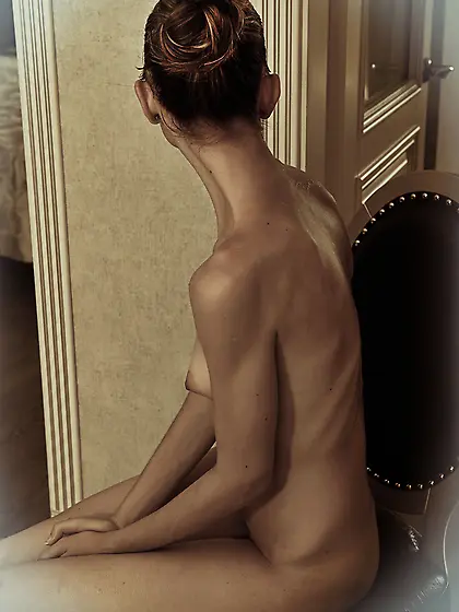 Before going in the shower slender gal peels off black lingerie