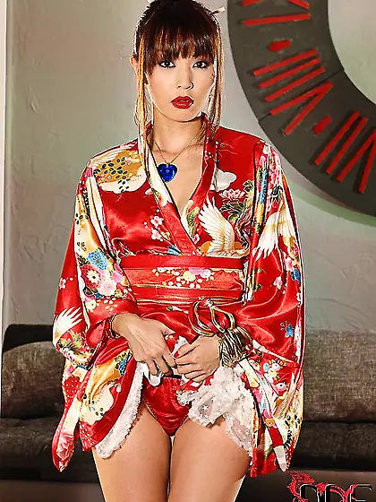 Exotic geisha seductively poses in living room while waiting for